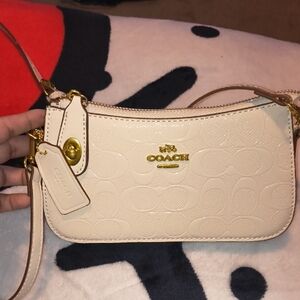 Coach Ivory Embossed Leather Wristlet